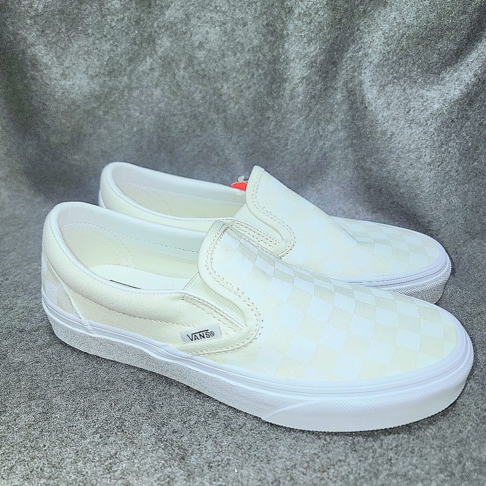 Vans Slip-On Skate shoe in a white color with a reflective checkerboard pattern.